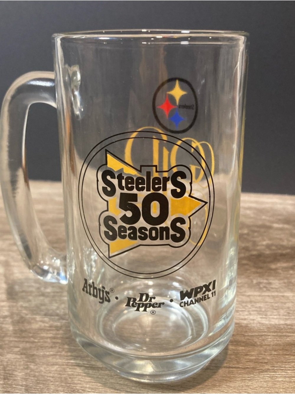 50 Seasons Glass Beer Mug - Clear with Yellow/Black Logo